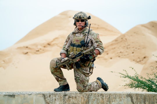 Photo of soldier in uniform with weapon