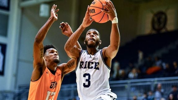 Rice basketball player Travis Evee eyes the rim as the Owls take on the University of Texas at El Paso.