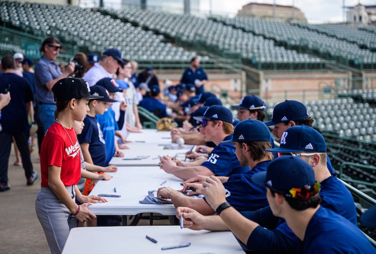 Rice baseball players sign autographs at the team's annual Fan Fest event on Feb. 5, 2023.