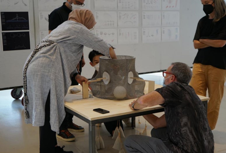 Architecture students build models.
