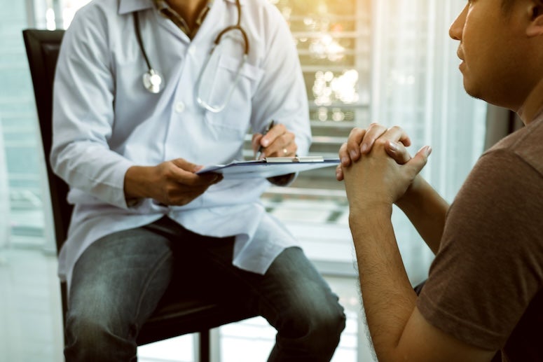 Doctor visiting with patient