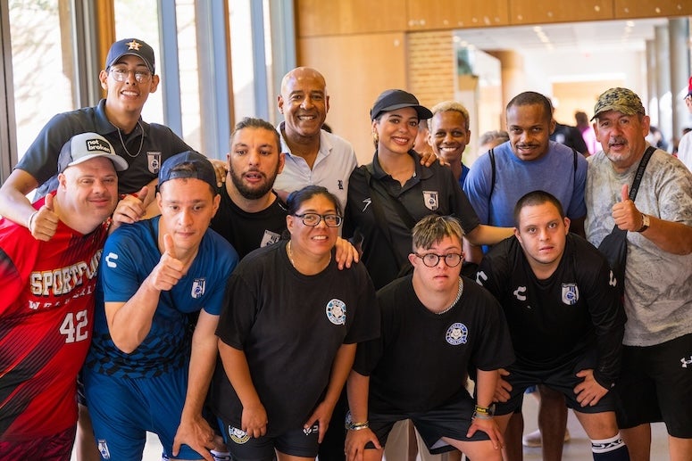 Rice President Reginald DesRoches takes a group picture at the Genuine World Cup Connect event Aug. 1, 2024.