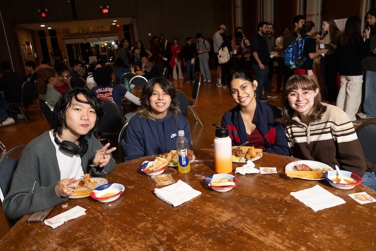 Students eat at the Pangea Potluck event in November 2024