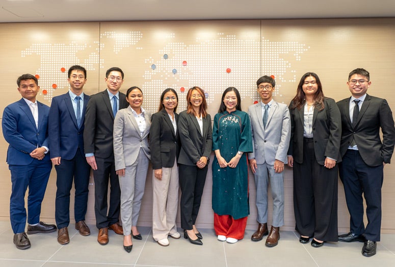 Rice graduate student Tawan “Pop” Kiratiwongwan poses for a photo with other Quad Fellows.