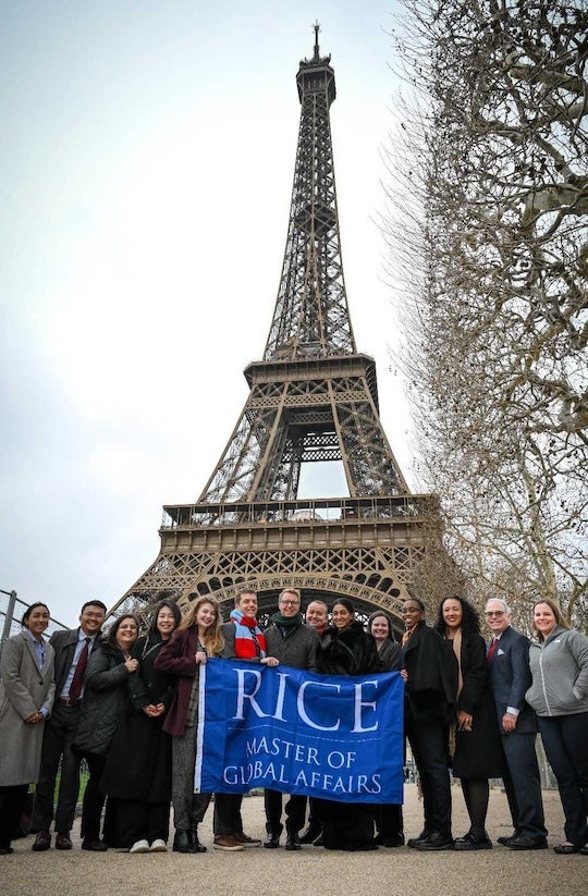 Rice MGA students in Paris, France in front of the Eiffel Tower