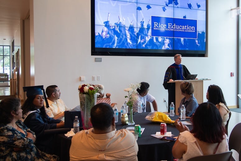 Rob Bruce speaks at the 2025 Rice Education graduation ceremony.