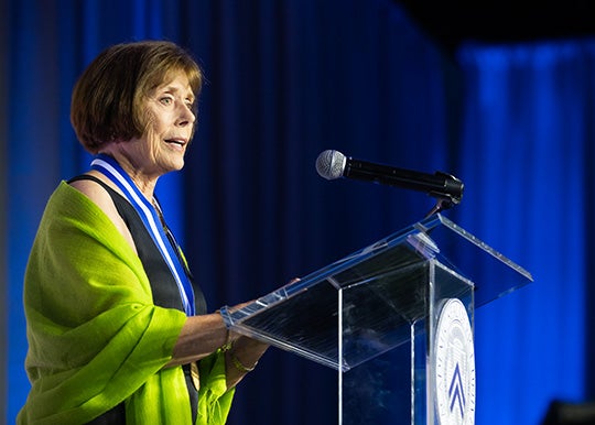 Kathie Maxfield accepting the award