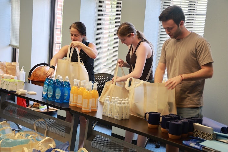 Rice University students and staff came together to pack care packages for refugees in Houston, offering essential supplies and a message of welcome and support.
