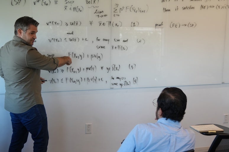 Professor teaching economics 