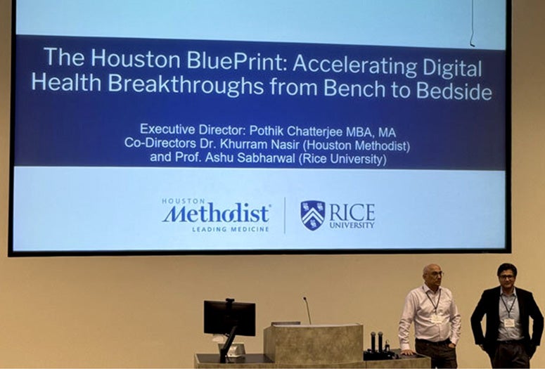 photo from event with lead organizers near a podium