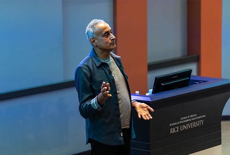 Man facing off to the side near a podium