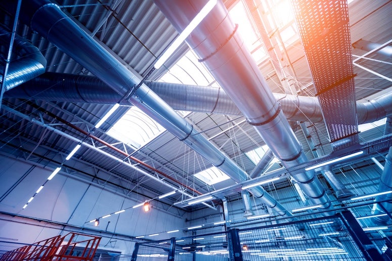 A stock image of an air conditioning system in an industrial building