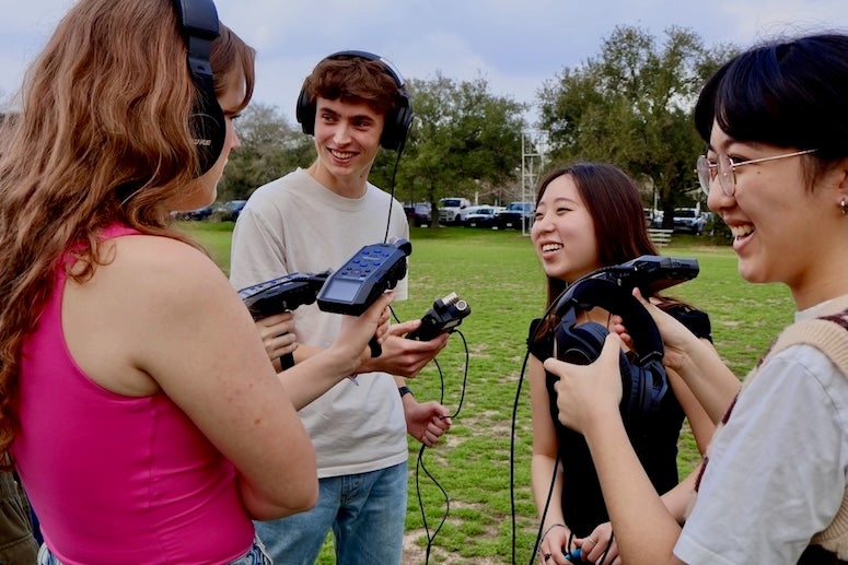 Students from the Houston Newsroom test out their new equipment.