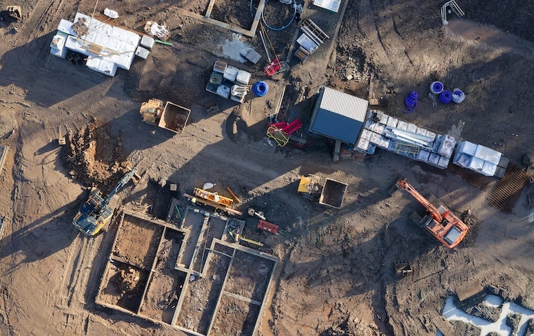 Stock image depicting aerial view of a construction site. 