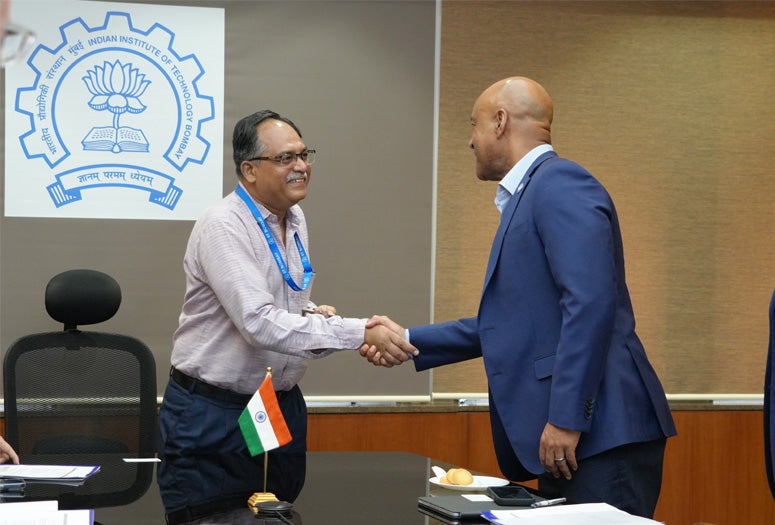 Reginald DesRoches shaking hands with IIT Bombay leader