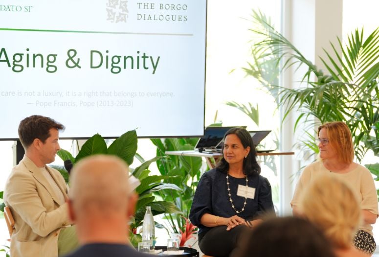 Amy Dittmar seated for a panel discussion with two other experts