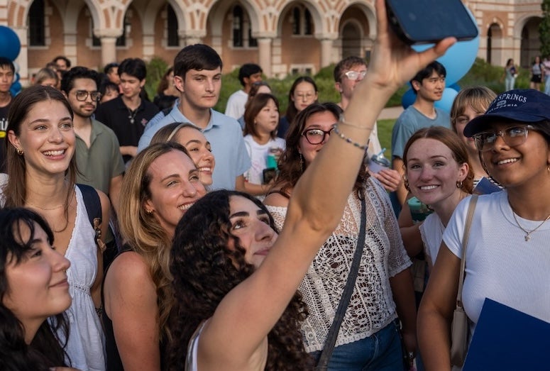 New masters students taking a selfie at Rice University.