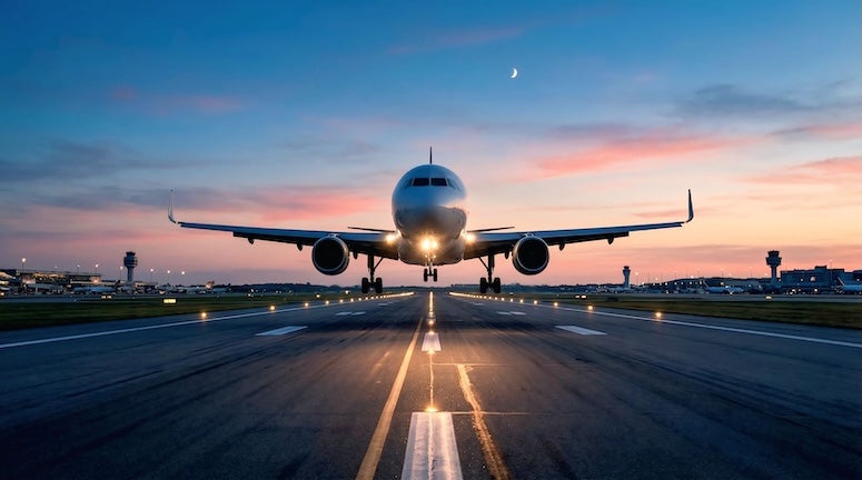 stock photo of a plane landing on a runway