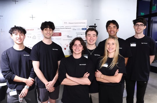 team of 7 students pose for the camera