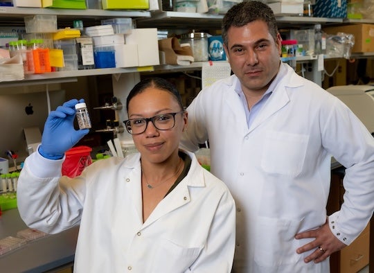 man and woman in lab coats