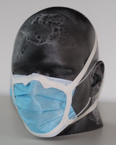 A silicone harness developed at Rice University, attached with an adhesive to a standard surgical mask, greatly improved the mask’s ability to keep airborne droplets out. (Credit: Robinson Lab/Rice University)