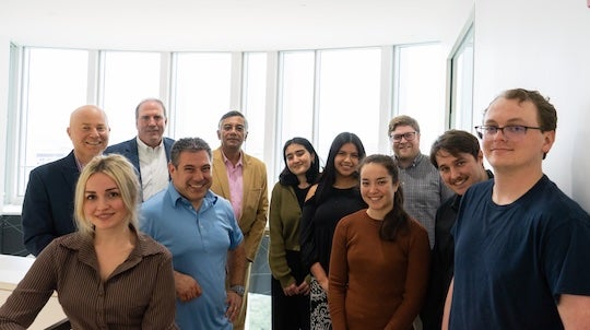 group of people posing in stairwell