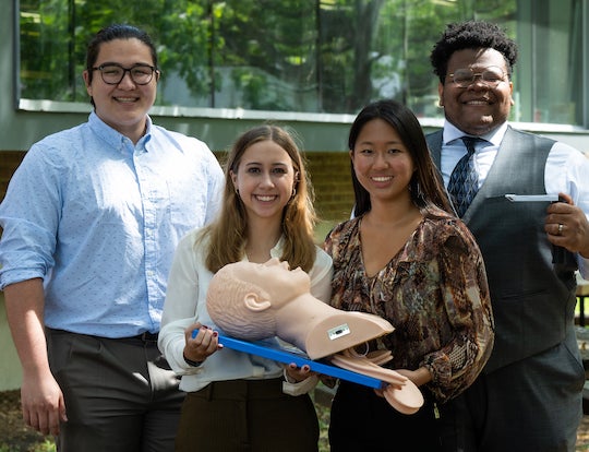 Rice University bioengineering students -- from left, Reed Corum, Rebecca Franklin, Victoria Kong and David Ikejiani -- have developed a simplified, wireless video laryngoscope to help clinicians intubate patients before procedures or in an emergency. 