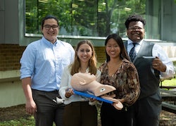 Rice University bioengineering students -- from left, Reed Corum, Rebecca Franklin, Victoria Kong and David Ikejiani -- have developed a simplified, wireless video laryngoscope to help clinicians intubate patients before procedures or in an emergency. (Credit: Jeff Fitlow/Rice University)