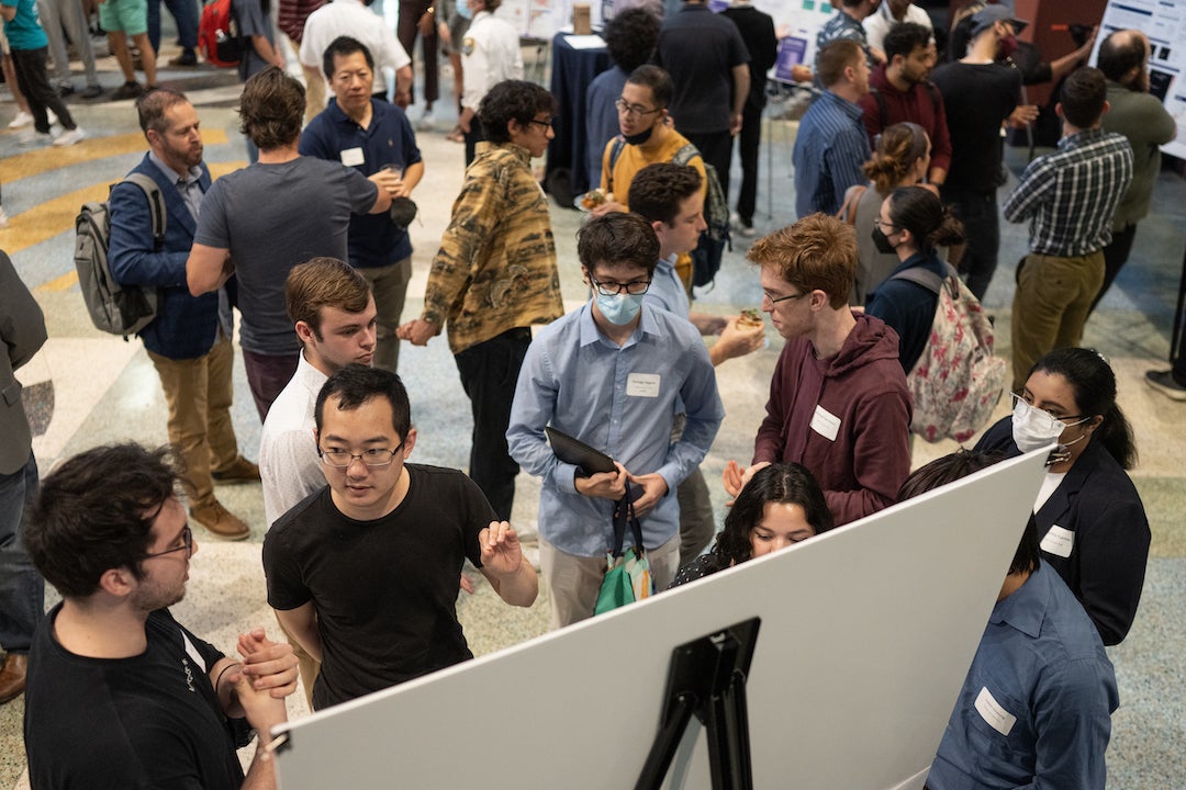 Students show their work at the Spring D2K Showcase poster exhibition. Photo by Jeff Fitlow