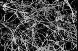 A tangle of unprocessed boron nitride nanotubes seen through a scanning electron microscope.  Rice University scientists introduced a method to combine fibers into them using a custom wet-spinning process to make carbon nanotube fibers.  (Credit: Pasquali Research Group / Rice University)