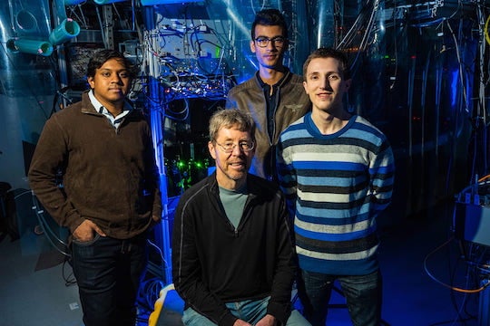 Rice physicists (from left) Ruwan Senaratne, Randy Hulet, Aashish Kafle and Danyel Cavazos built a quantum simulator to measure spin-charge separation, an effect where spin and charge, traits of indivisible particles called electrons, move through 1D wires at different speeds. (Photo by Jeff Fitlow/Rice University)