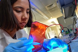 Rice University graduate student Maria Claudia Villegas Kcam filters DNA for an experiment to target “silent” genes in a strain of bacteria that show potential for developing new antibiotics. (Credit: Jeff Fitlow/Rice University)