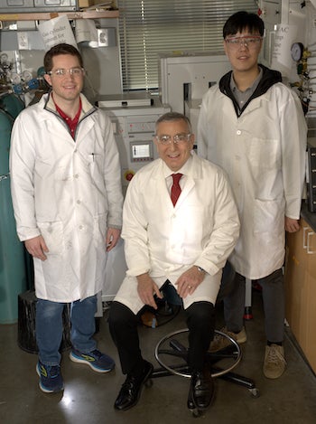 Rice University chemists modify waste plastic to absorb carbon dioxide from flue gas streams more efficiently than current processes. From left: Paul Savas, James Tour and Zhe Yuan. (Credit: Jeff Fitlow/Rice University)