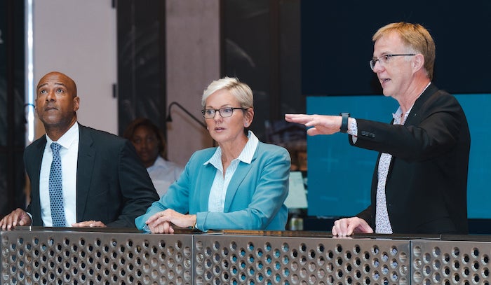 Rice President Reginald DesRoches and Secretary of Energy Jennifer Granholm gets a quick briefing on the Ion from Jan Odegard, executive director of the facility. Photo by Jeff Fitlow