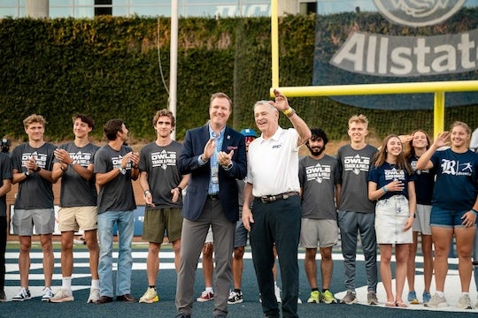 Fred Hansen is joined by Tommy McClelland as Hansen is recognized during a Rice football game Oct. 12, 2024.
