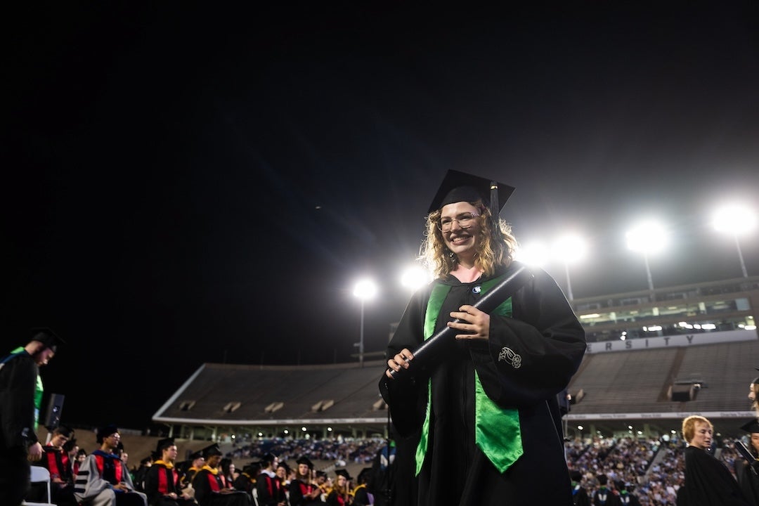 Class of 2024 graduates walk during the 111th commencement ceremony.