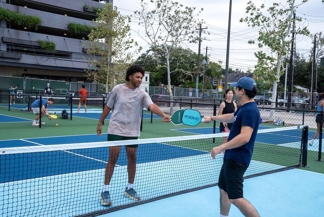 Rice students play pickleball at the Pickle Lab in the Ion District.