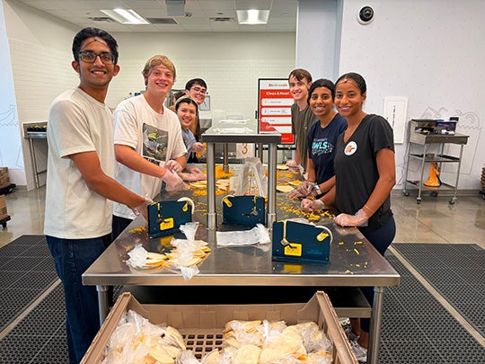Students making sandwiches at Kid's Meals