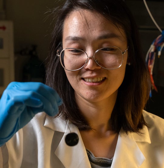 Rice University postdoctoral researcher Xu Zhang prepares a water sample for testing with programmable bacteria that test for contaminants and release an electronic signal for detection in real time. (Credit: Brandon Martin/Rice University)
