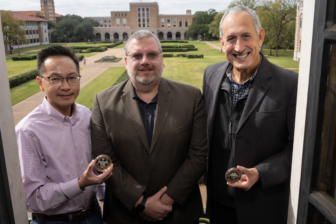 From left, Michael Wong of Rice, Mike Reynolds of Shell and Pedro Alvarez of Rice display medals given to them as winners of the American Chemical Society Southwest Regional Partners in Progress & Prosperity Award. 