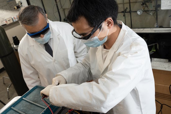 Rice University chemist James Tour and postdoctoral researcher Bing Deng set up a flash Joule heating experiment. The lab has adapted its process to extract rare earth elements from coal fly ash, bauxite residue and electronic waste. Photo by Jeff Fitlow