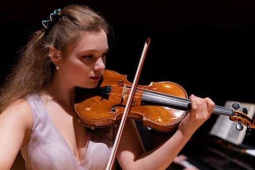 Clara Saitkoulov performs on the Stradivarius violin. Photo by Brandon Martin.