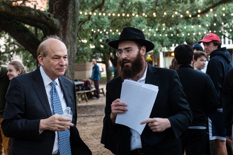 President Leebron and Rabbi Shmuli talk at menorah lighting ceremony