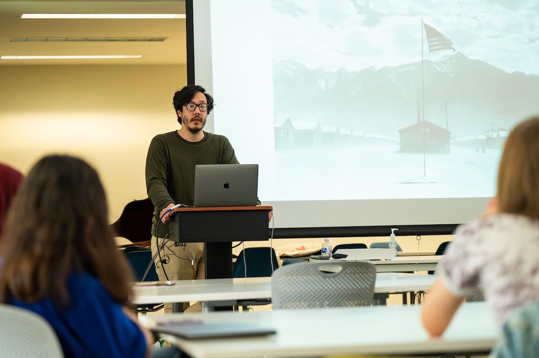 Ethnomusicologist Julian Saporiti gives a presentation to a group in Herring Hall