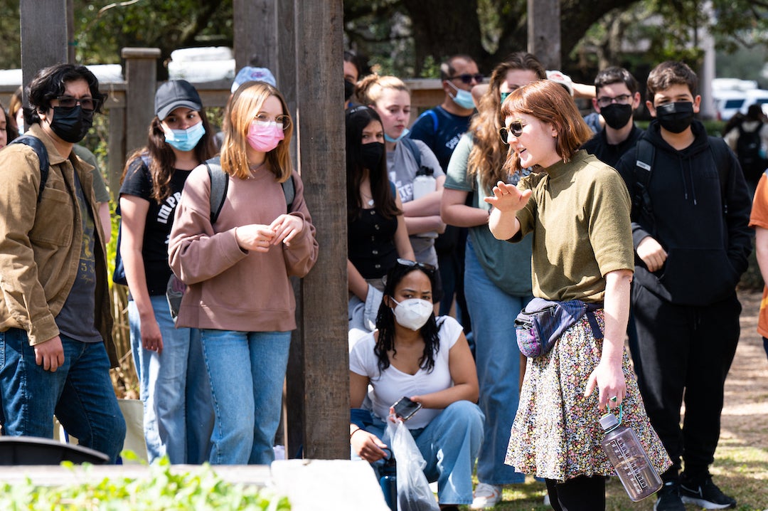 Jade Hagan takes a group of high school students from the International School of the Americas on a tour of Rice's campus garden