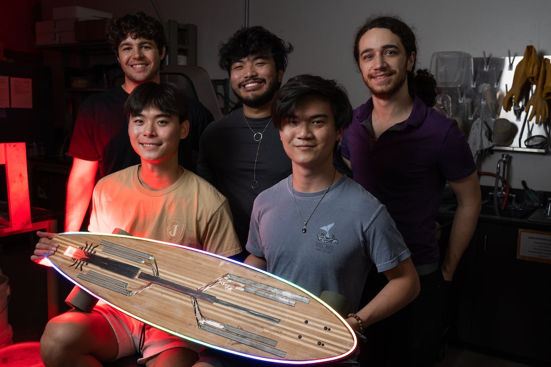 Team Breadboard showing off their award-winning electric longboard