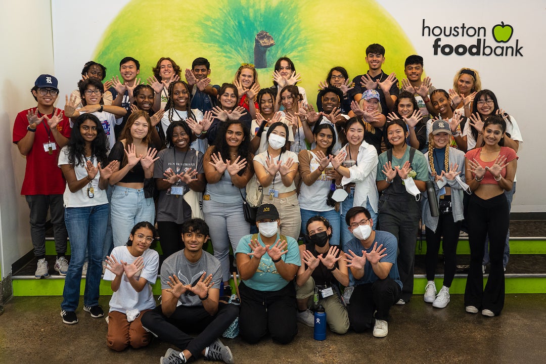 Rice students posing for group picture after volunteering at Houston Food Bank