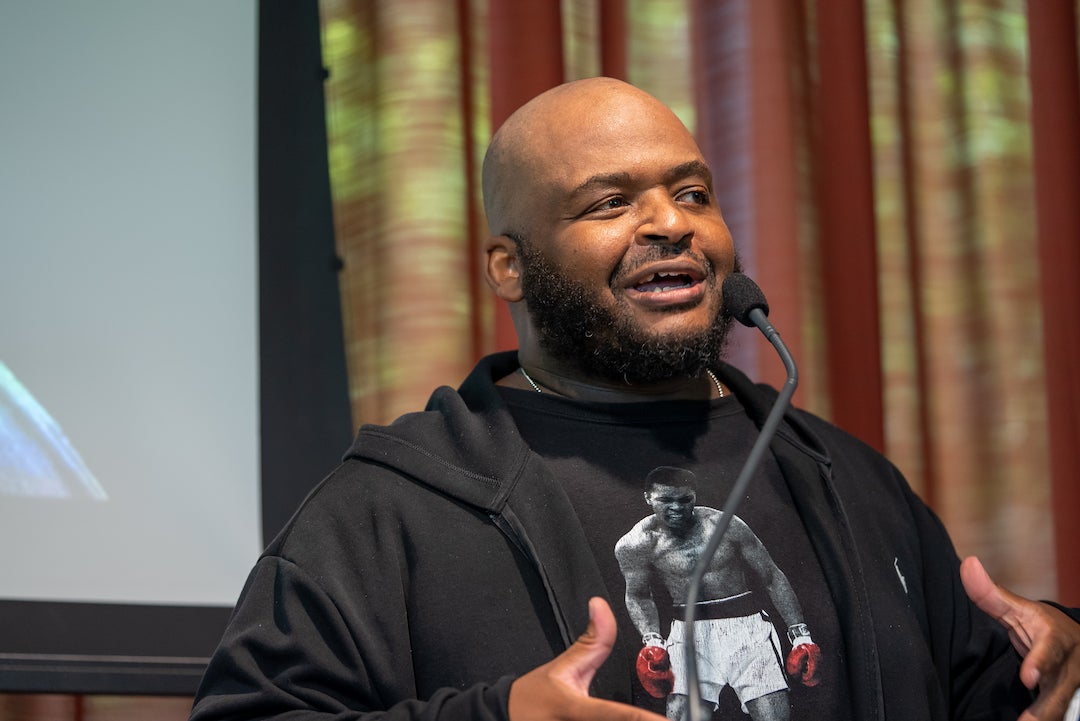 Rice University English professor Kiese Laymon speaking at event