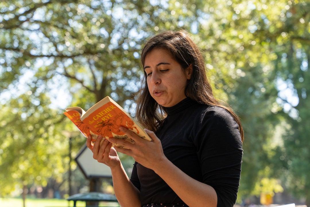 Woman reads from The Catcher in the Rye at banned books read out event