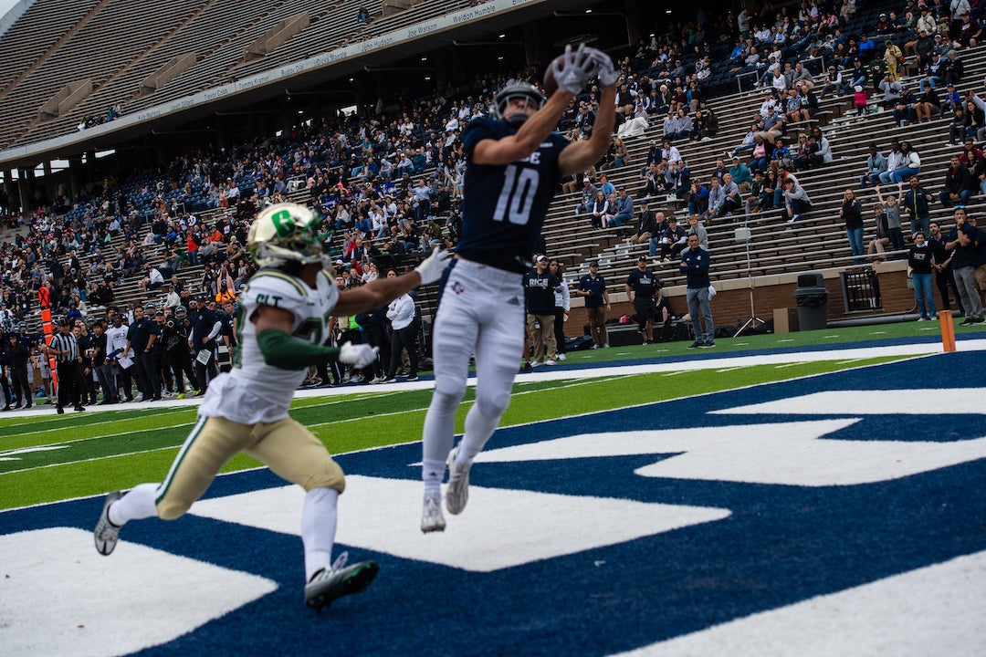 Rice football players mid-game at homecoming game 2022